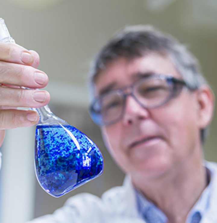 Scientist examining a text probe