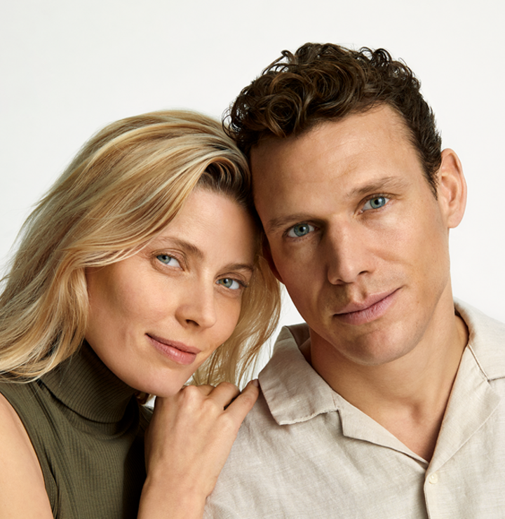 A portrait of a couple looking into the camera